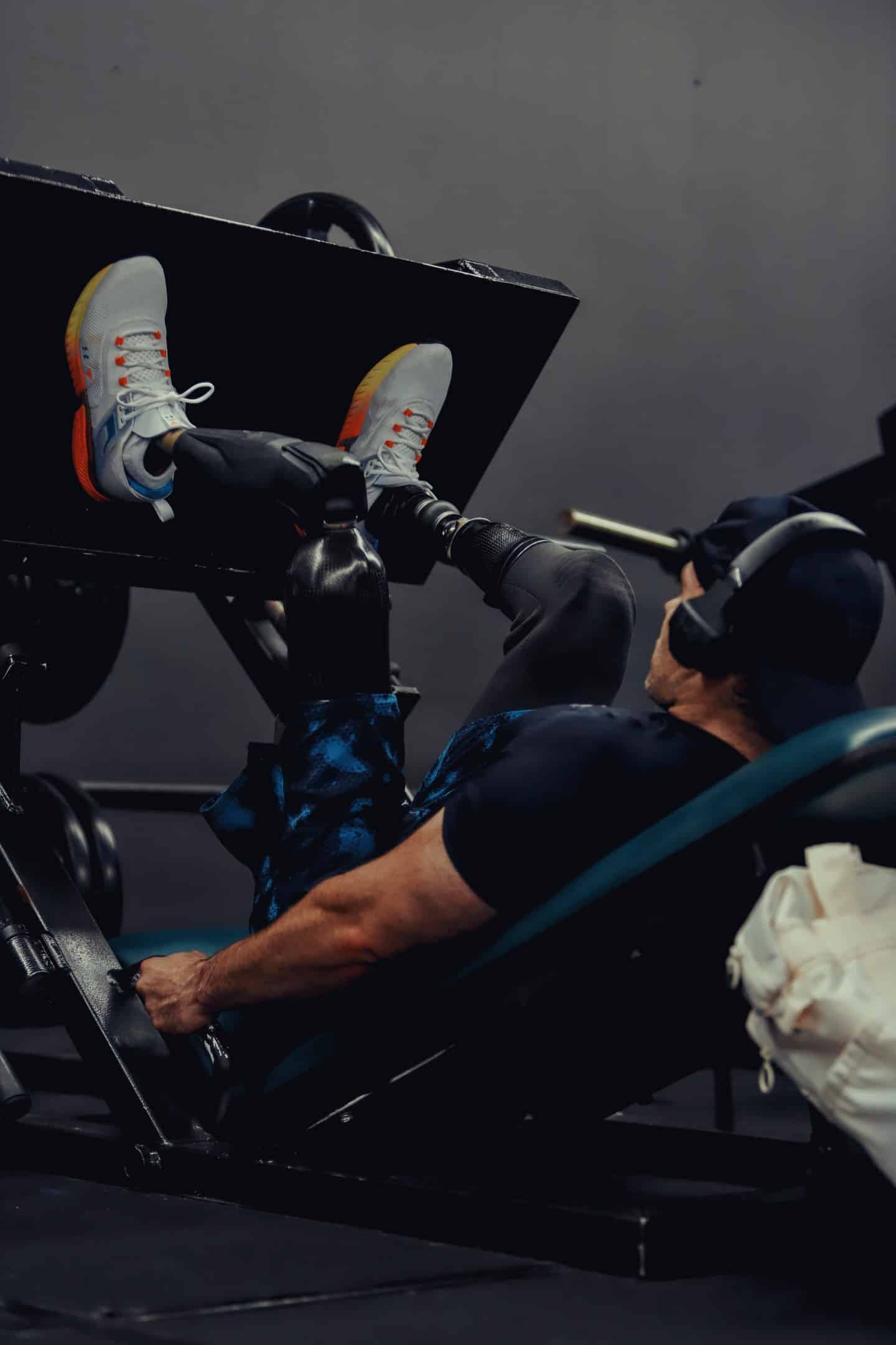 Lane works through a leg press at the gym, training on bilateral prosthetics with the same discipline he carried into combat. Photo courtesy of JP and Crystal Lane