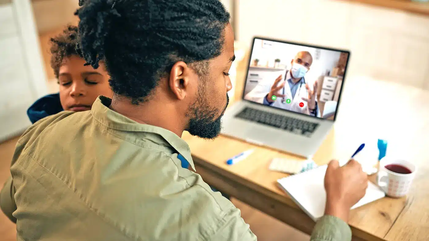 A veteran connects with a VA emergency care provider through VA Health Connect. The program routes callers from the nurse triage line to a board-certified emergency physician on video, typically within five minutes. (U.S. Department of Veterans Affairs)